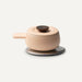 Beige ceramic pot with a dark brown lid on a white background