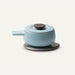 Light blue ceramic pot with a dark brown lid on a white background