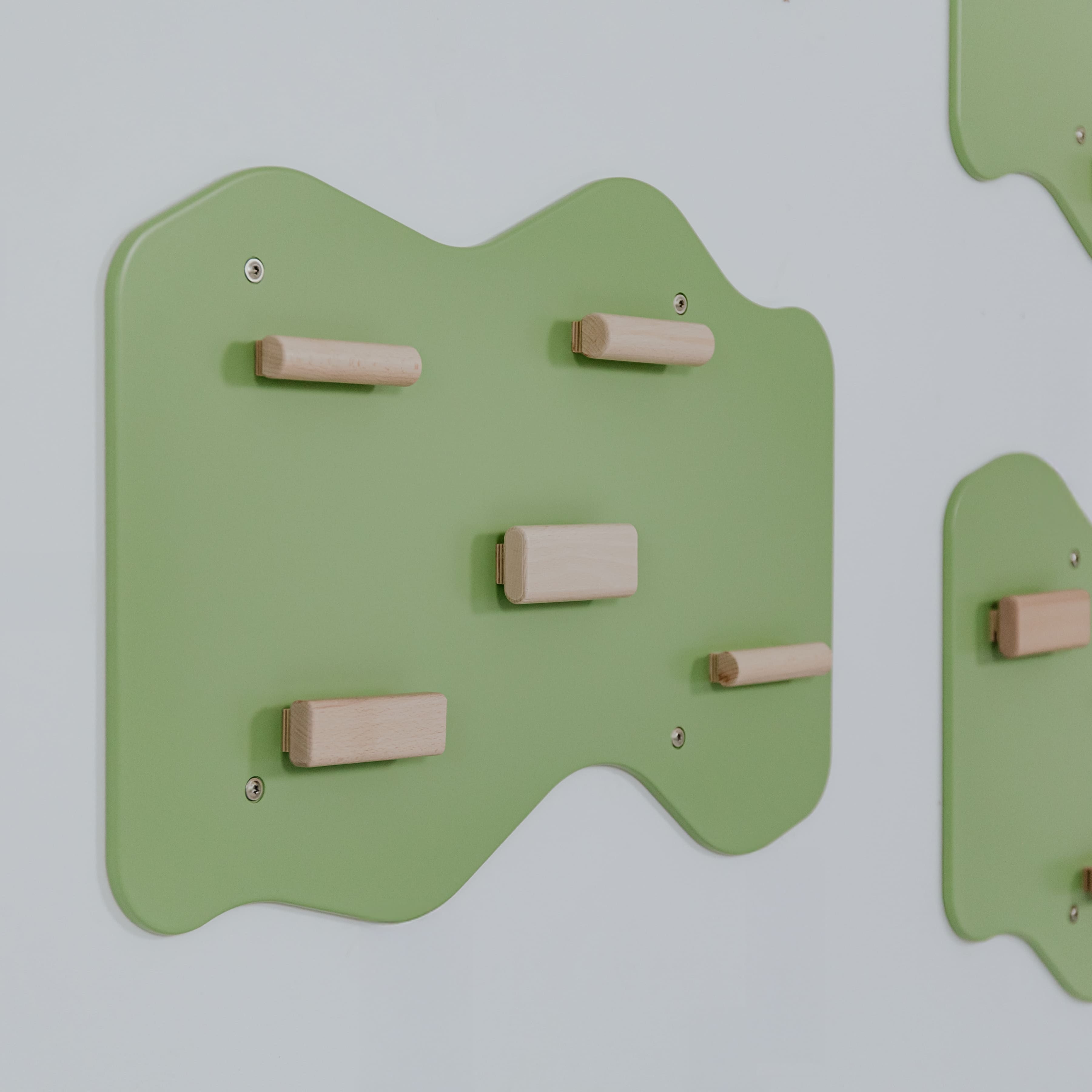 Indoor Rock Wall with Cloud-Shaped Panels & Wooden Climbing Holds