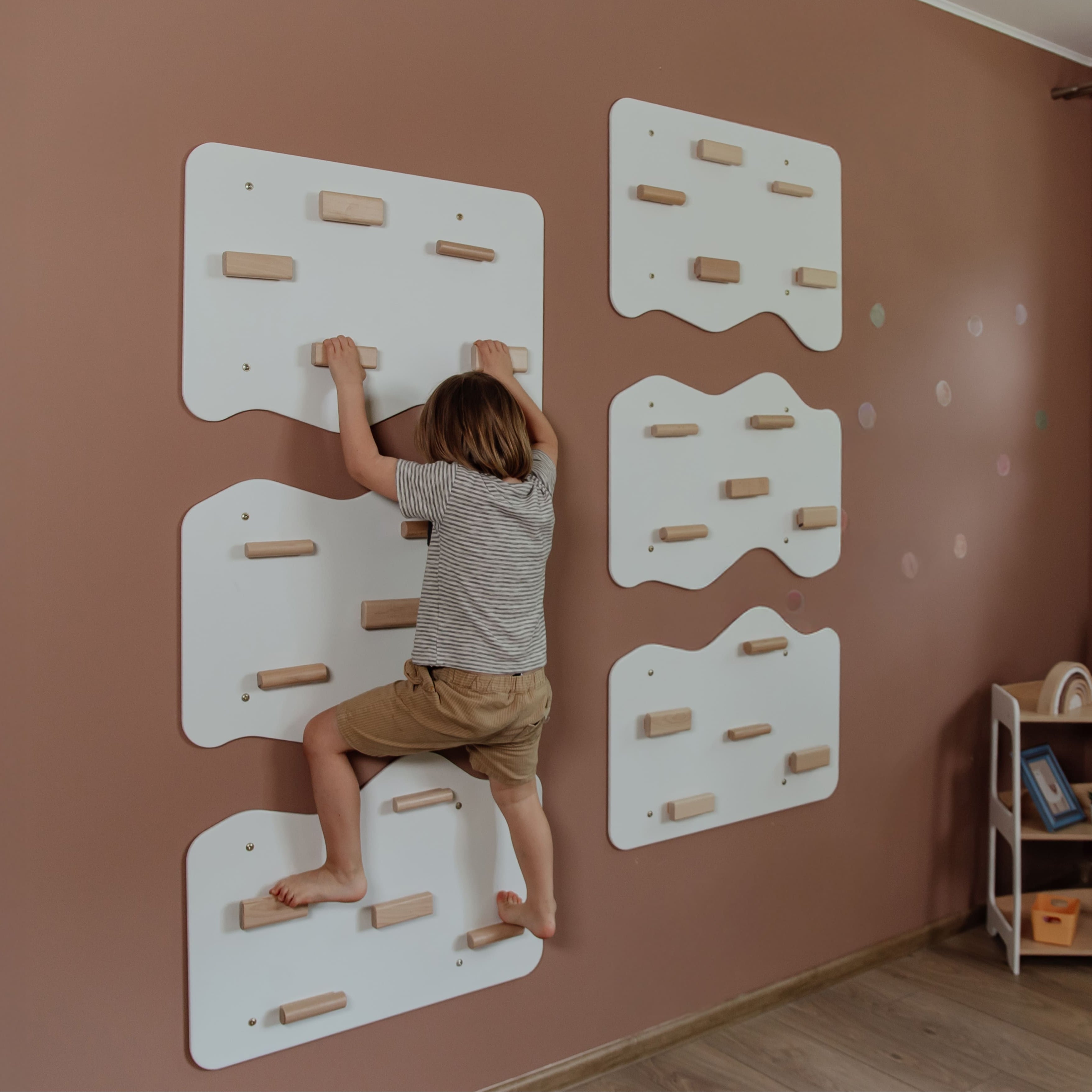 Indoor Rock Wall with Cloud-Shaped Panels & Wooden Climbing Holds