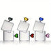 Set of clear glass tumblers with colorful heart-shaped handles on a white background