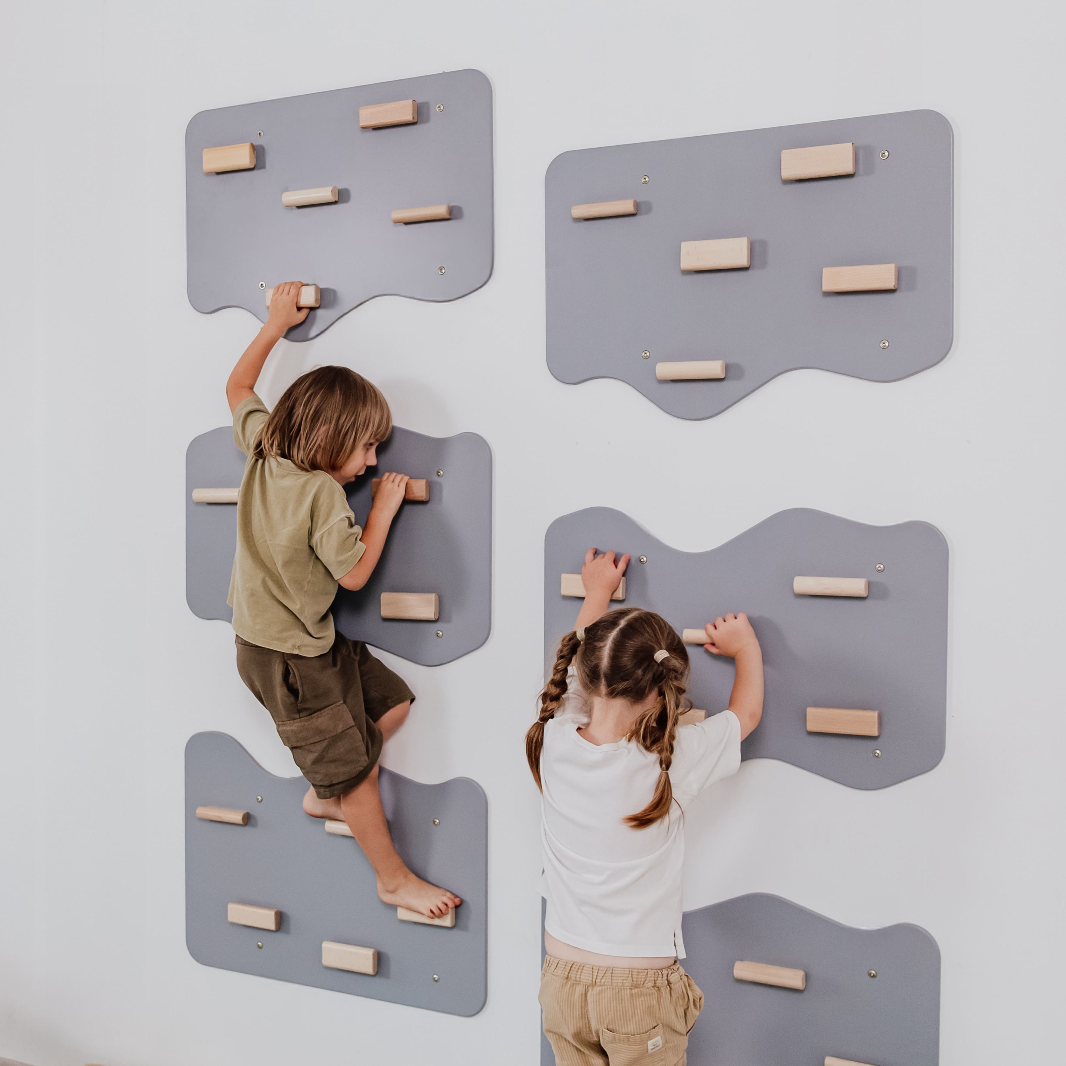 Indoor Rock Wall with Cloud-Shaped Panels & Wooden Climbing Holds