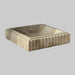 Square stone basin with ribbed texture on a light background