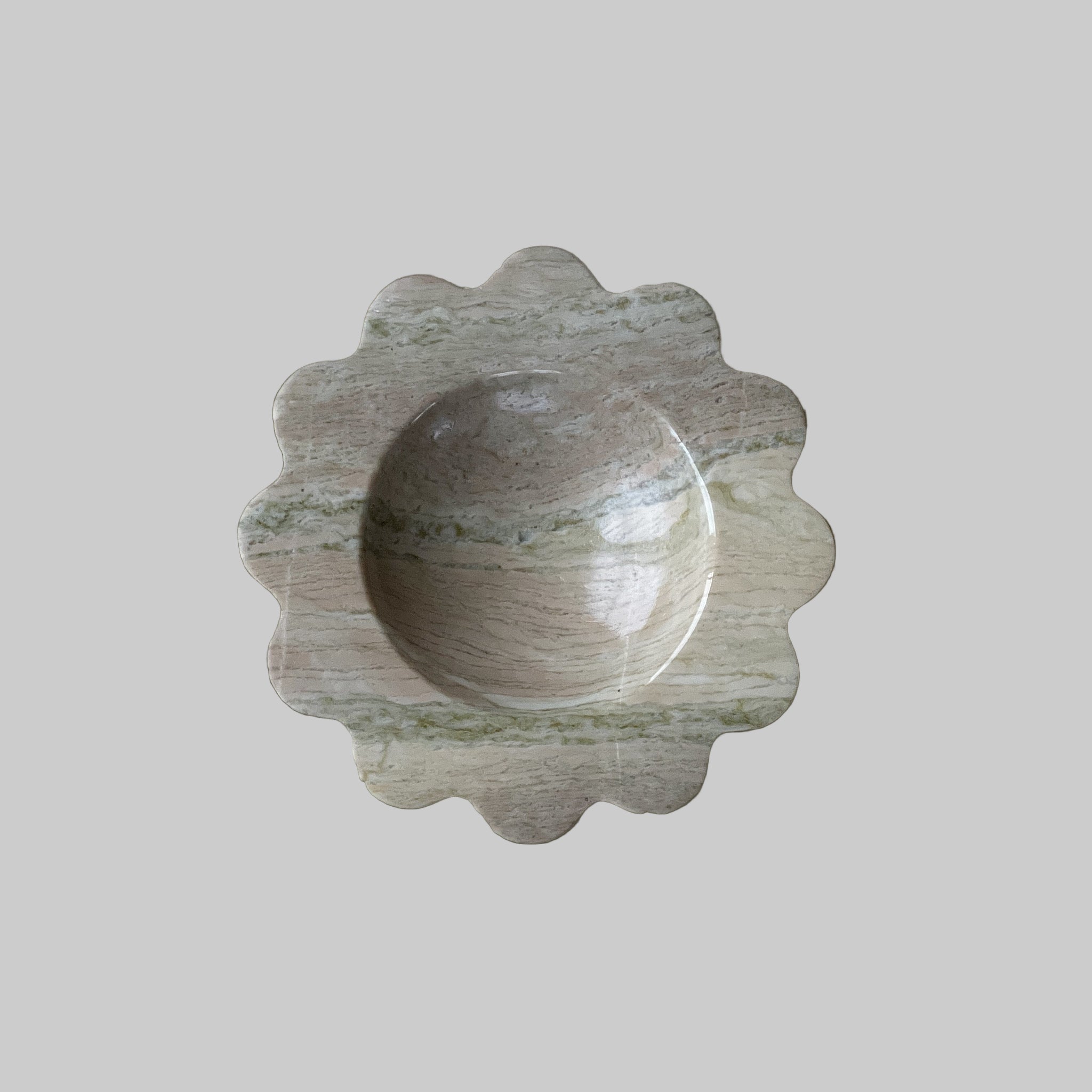 Decorative stone bowl on a light gray background