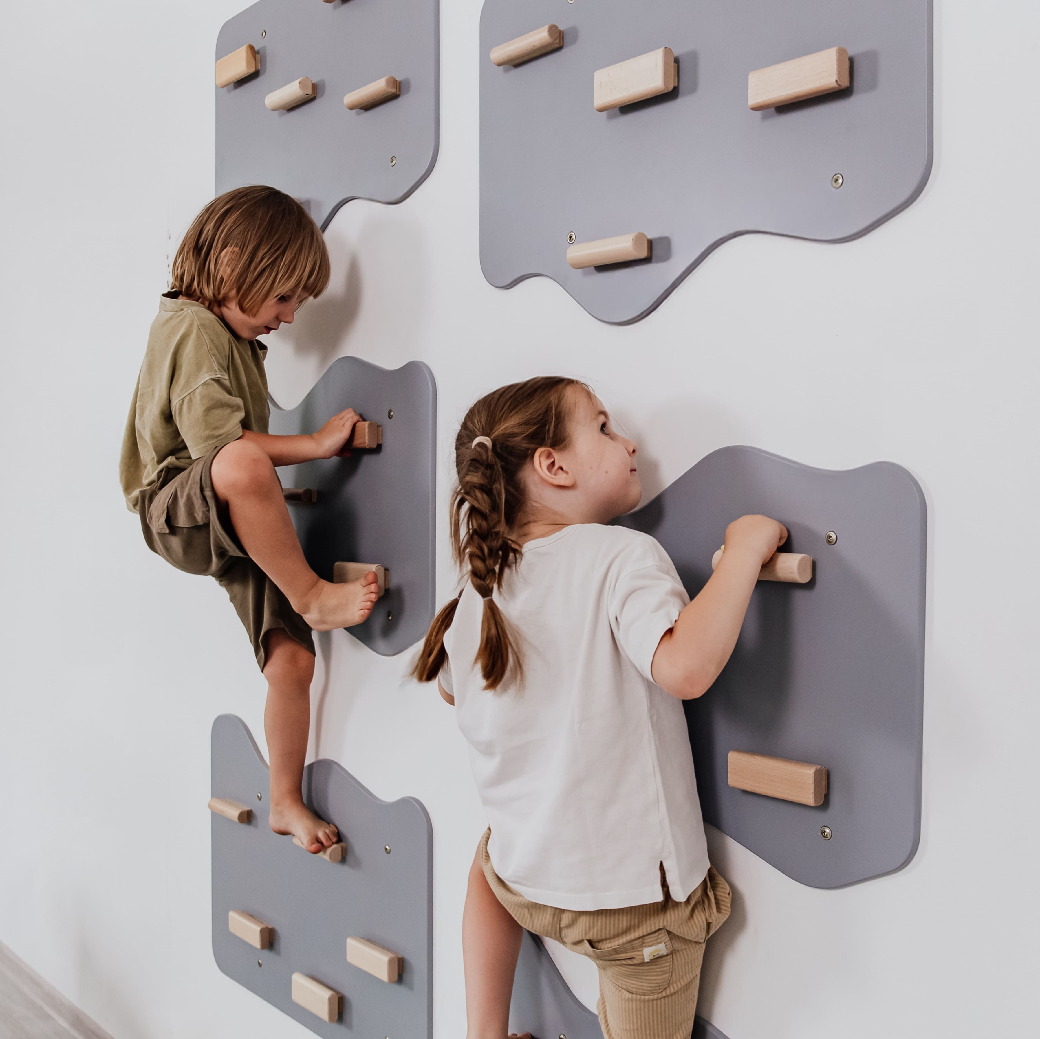 Indoor Rock Wall with Cloud-Shaped Panels & Wooden Climbing Holds